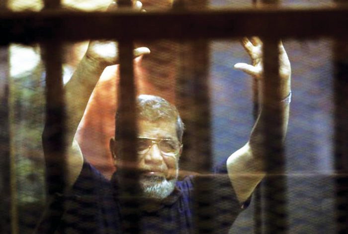 Mohamed Morsi died in court, in a soundproof cage under guards’ watch