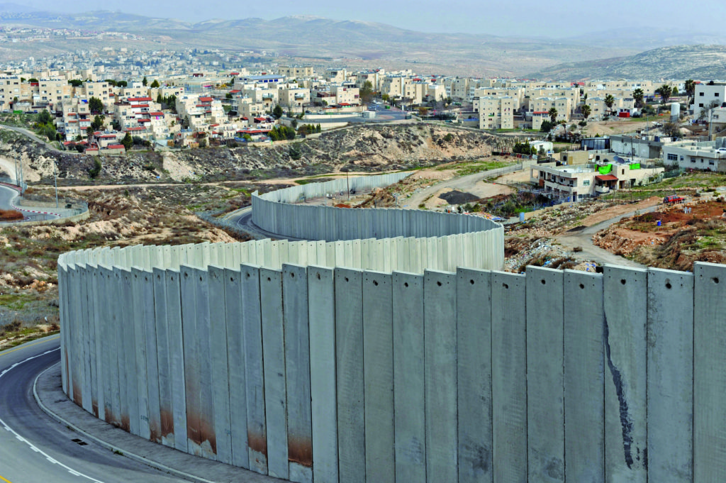 The Israeli separation wall divides the Pisgat Zeev Israeli Settlement, on the left, and the Shuafat Refugee Camp, on the right, outside Jerusalem, Jan. 25, 2011. Photo: Debbie Hill/UPI