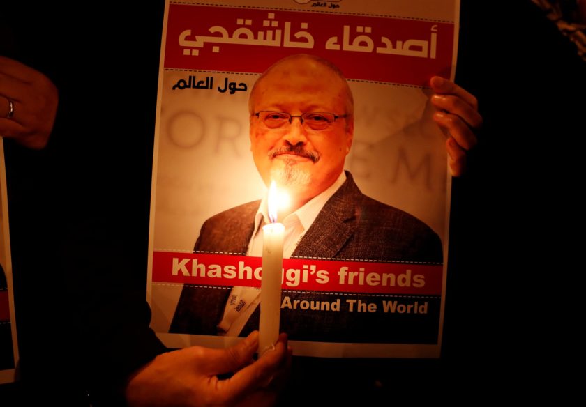 A demonstrator holds a poster with a picture of Saudi journalist Jamal Khashoggi outside the Saudi Arabia consulate in Istanbul, Turkey October 25, 2018. REUTERS/File Photo