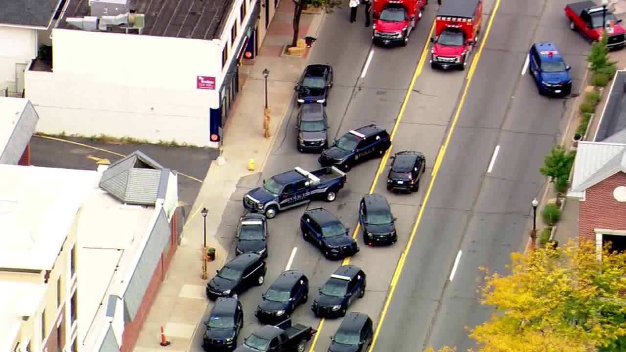 Dearborn Police squad cars and a bomb squad unit truck line Michigan Avenue outside the Hampton Inn Thursday afternoon during an active shooter situation at the hotel, Oct. 6. Photo: WXYZ Channel 7 News