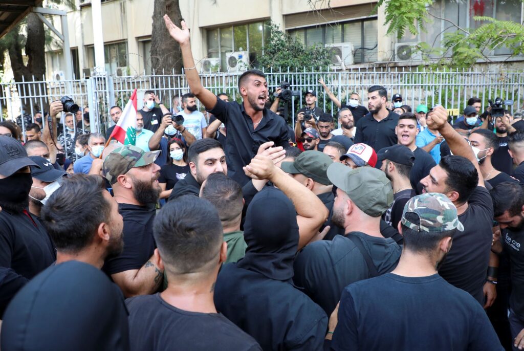 Supporters of Lebanese Shi'a groups Hezbollah and Amal and the Christian Marada movement take part in a protest against Tarek Bitar, the lead judge of the port blast investigation, near the Justice Palace in Beirut, Lebanon Oct. 14. Photo: Mohamed Azakir/Reuters