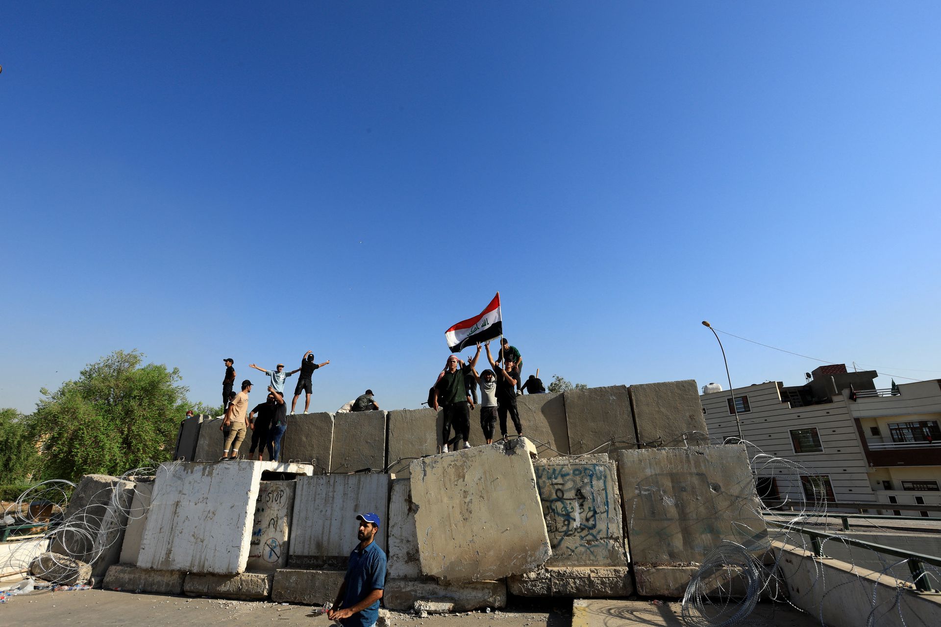 Supporters of Iraqi populist leader Moqtada al-Sadr protest inside the Green Zone, in Baghdad, Iraq Aug. 29. Photo: Thaier Al-Sudani/Reuters