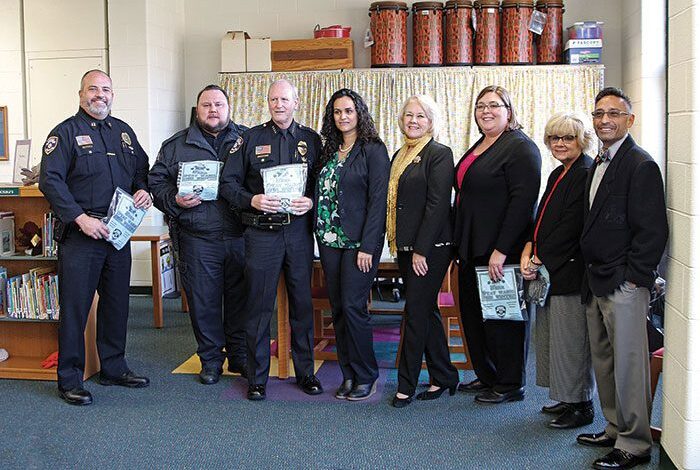 Dearborn Heights police donate winter wear to school children