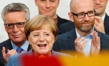 Germany's Merkel hangs on to power but bleeds support to surging far right