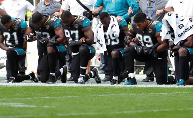 NFL players, managers defy Trump on anthem protests