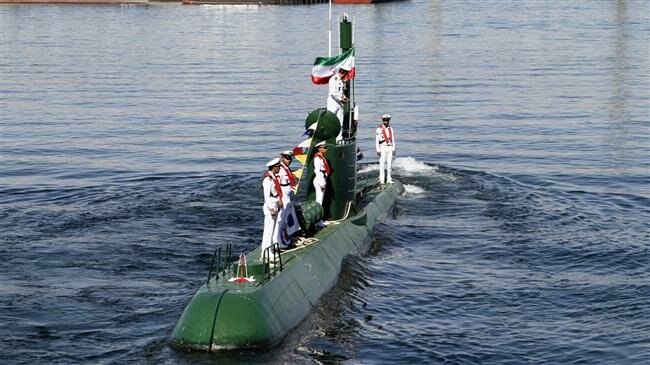 n this photo, Iran’s navy members stand on Ghadir-942 submarine in southern port of Bandar Abbas, Iran, at the mouth of the strategic Strait of Hormuz, Nov. 29, 2018. (By Mehr)