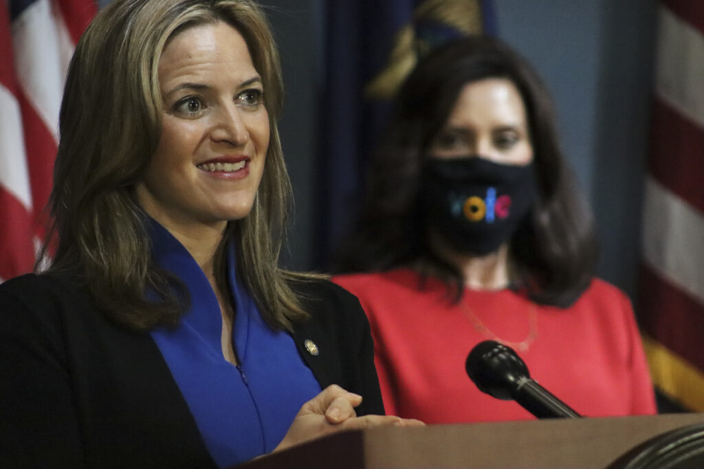 Michigan Secretary of State appears next to Governor Whitmer at a live address from Lansing, Wednesday, Sep. 16. Photo: Office of the Governor