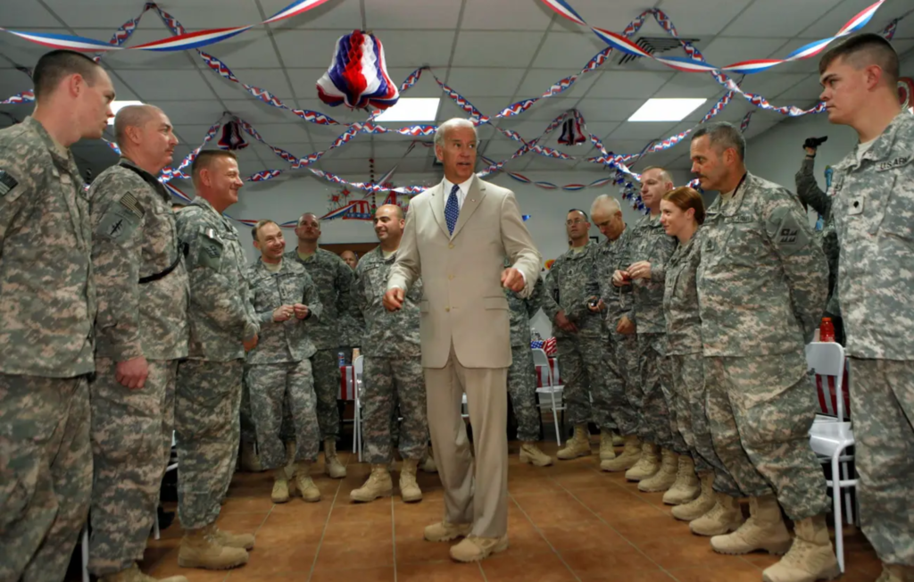 Biden, then Vice President, talks to soldiers at Camp Victory, on the outskirts of Baghdad, July 4, 2009. REUTERS