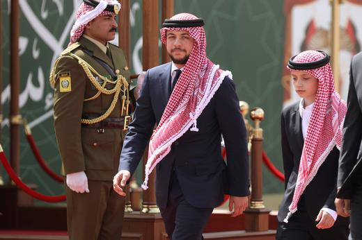 Jordan's Crown Prince Hussein bin Abdullah and his brother Prince Hashem attend a ceremony. Photo: Muhammad Hamed/Reuters