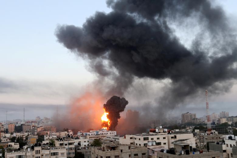 Smoke and flames rise during Israeli air strikes amid a flare-up of Israeli-Palestinian violence, in Gaza, May 12. Photo: Ibraheem Abu Mustafa/Reuters