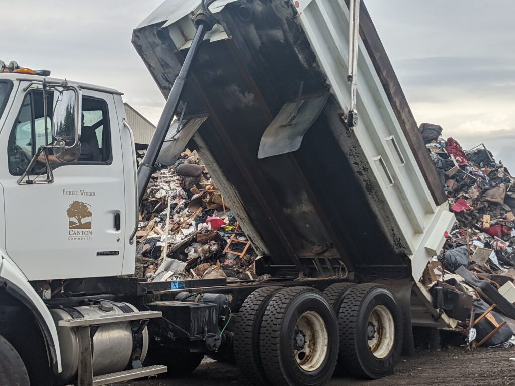 Flood debris is disposed of at a dump site in Dearborn