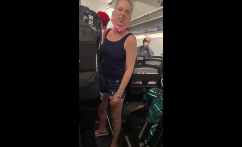 Woman arrested after assaulting Muslim woman on flight to Detroit on Sept. 11