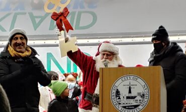 Mayor Bill Bazzi gives Santa the key to the city