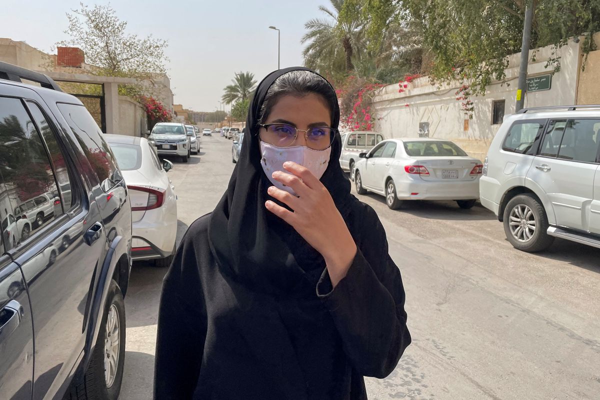 Saudi activist Loujain al-Hathloul makes her way to appear at a special criminal court for an appeals hearing, in Riyadh, Saudi Arabia March 10, 2021. Photo: Ahmed Yosri/Reuters