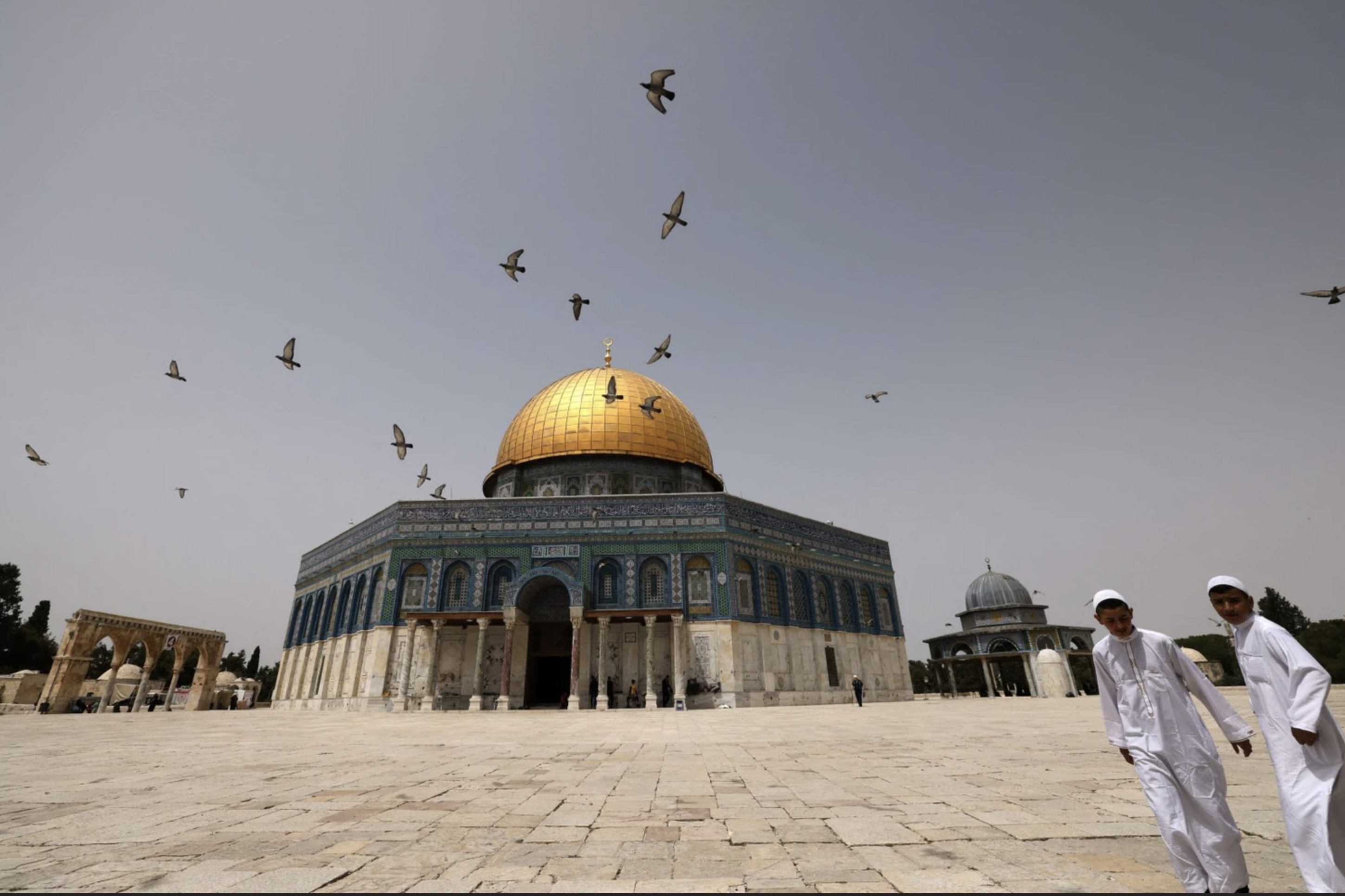Palestinian Muslims walk in front of the Dome of Rock at the Al-Aqsa mosque in Jerusalem's Old City, occupied Palestine, 17 April 2022. – Photo by AFP.