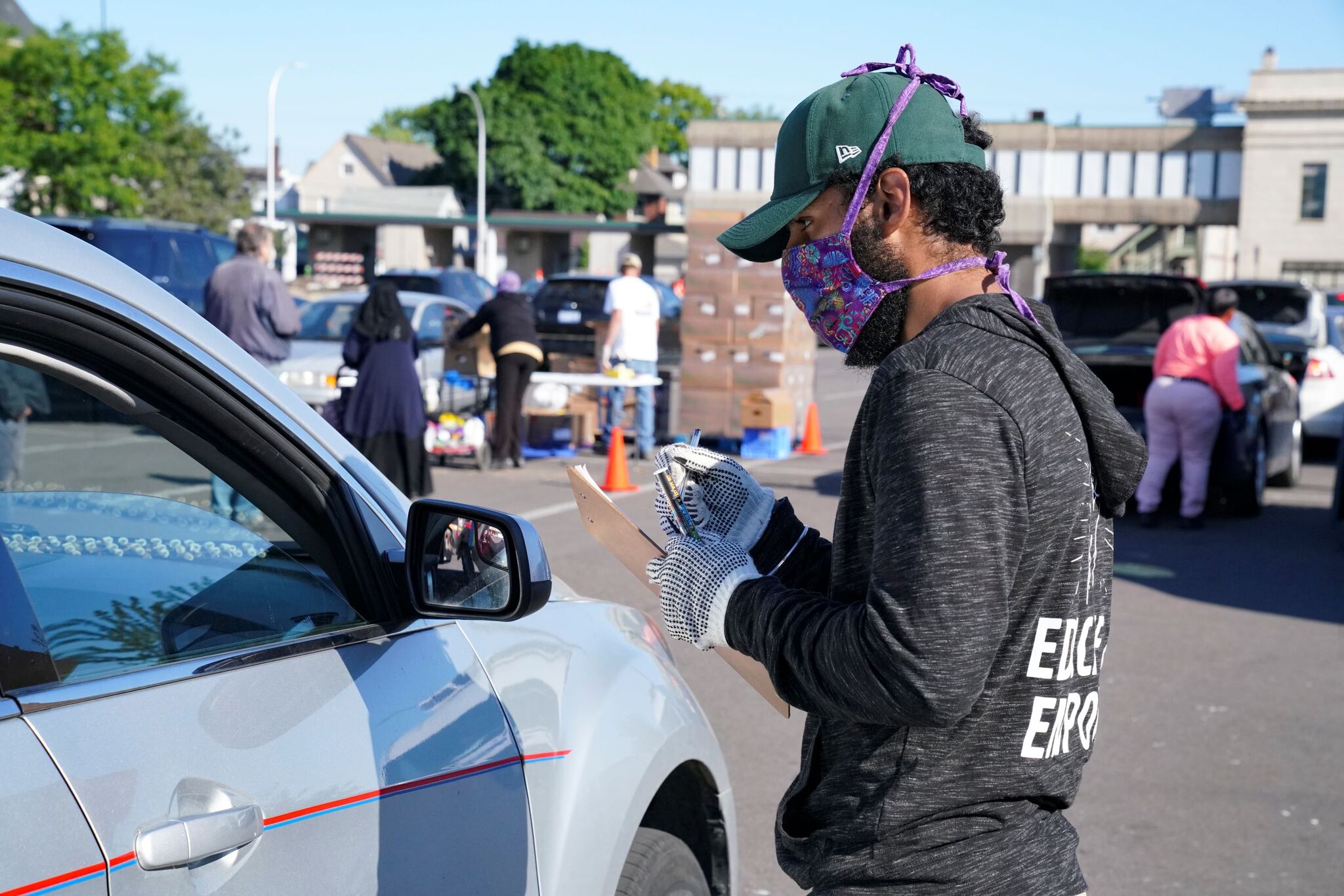 A Gleaners food distribution volunteer at drive-thru site in Detroit. Photo: Gleaners Community Food Bank