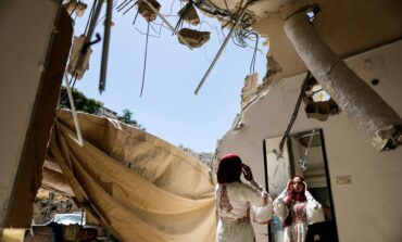 A Palestinian bride celebrates in the rubble of her demolished Jerusalem home