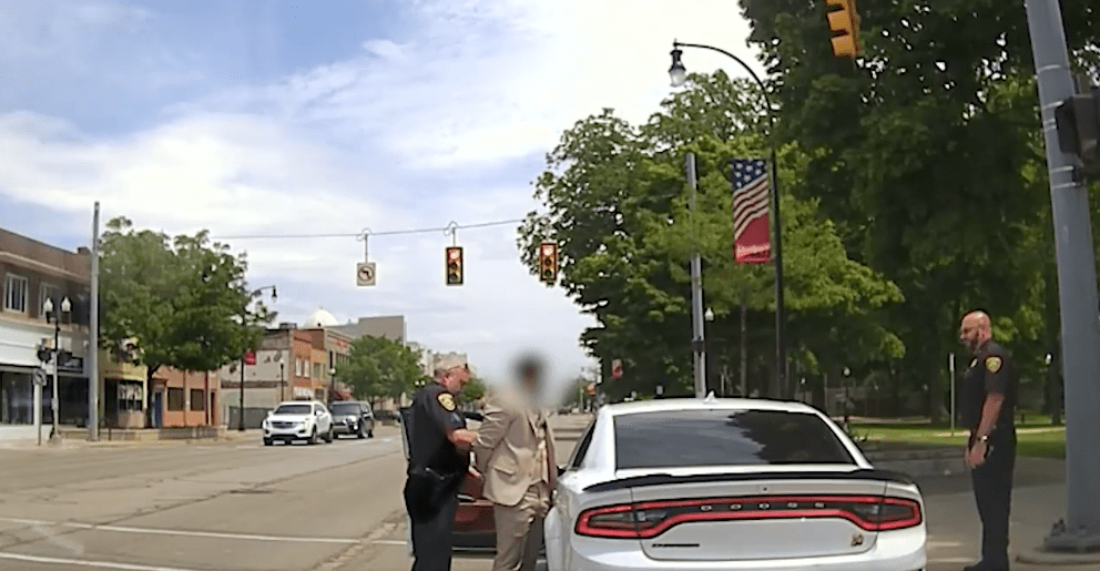 A driver who was earlier involved in doing burnouts in front of the Dearborn Police Department is arrested, in Dearborn, June 2. Photo: Screenshot/Dearborn Police Department