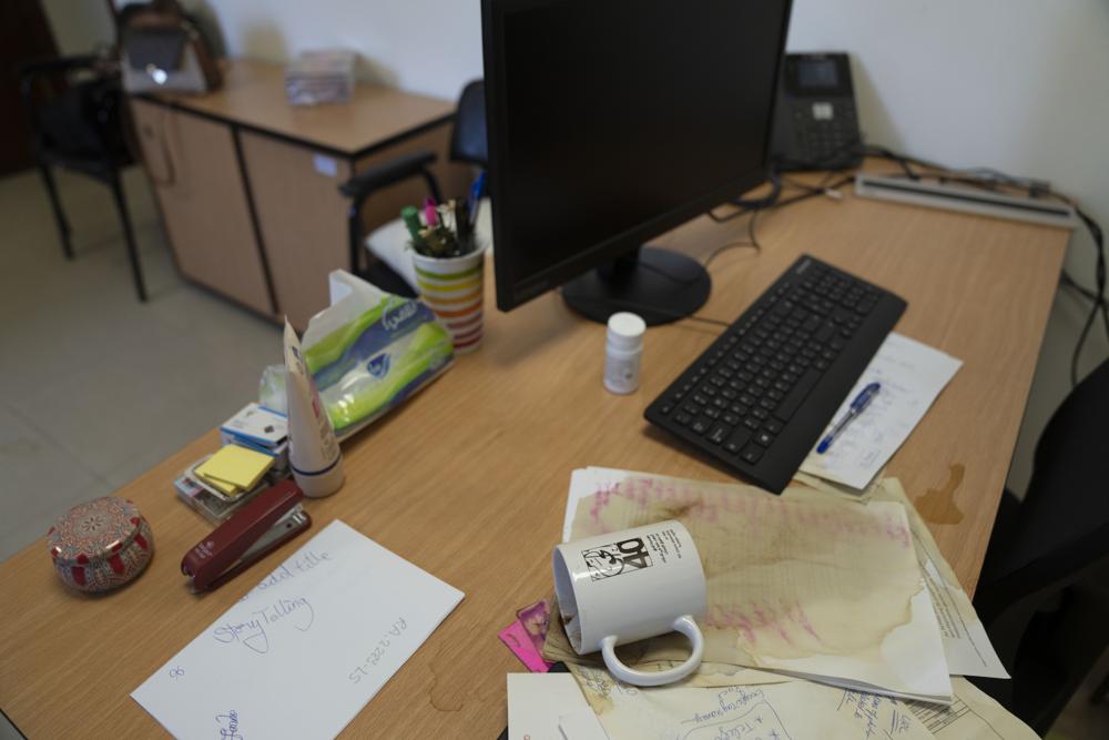 Spilled coffee on a desk at the al-Haq Human rights organization that was raided by Israel forces in the West Bank city of Ramallah, Aug. 18. Photo: Nasser Nasser/AP