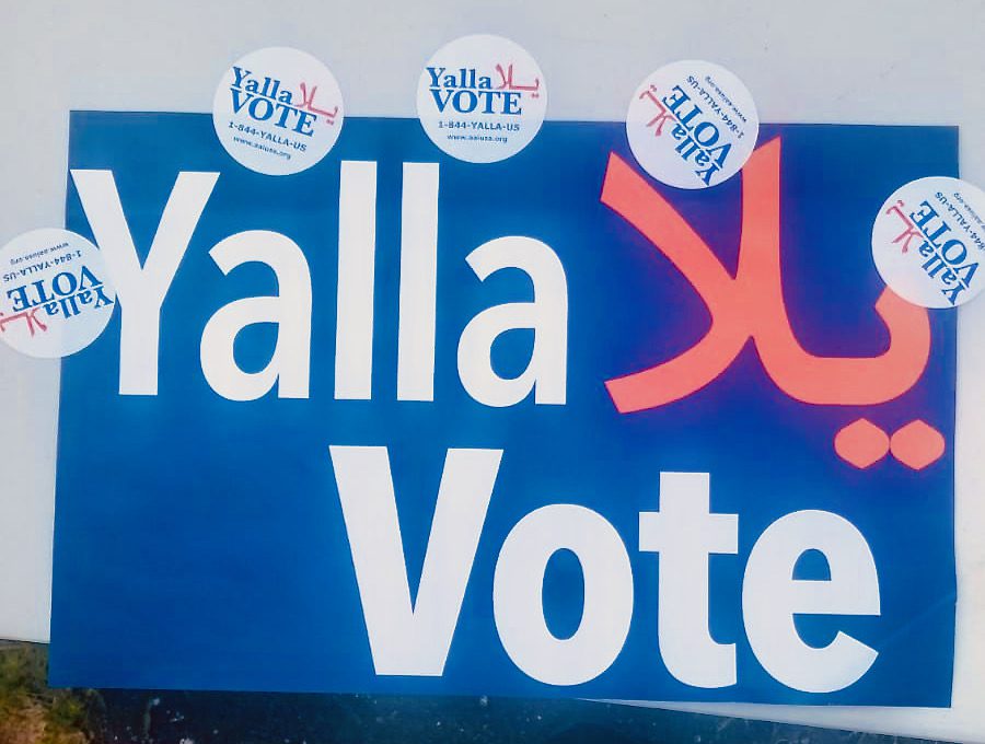 A "Yalla Vote" sign outside of a east Dearborn precinct encourage residents to come out and vote