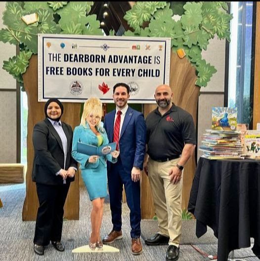 Danielle Elzayat (l), Amity Foundation co-founder, stands next to a Dolly Parton life-sized cut out with Dearborn Mayor Abdullah Hammoud and Amity Foundation founder Amad Elzayat. Photo: City of Dearborn