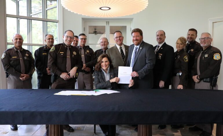 Whitmer signs bills to put more officers on the road